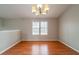 Dining area with hardwood floors and a chandelier at 5175 Walker Rd, Stone Mountain, GA 30088