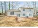 Rear exterior view of two-story home with patio at 5175 Walker Rd, Stone Mountain, GA 30088