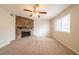 Cozy living room with a stone fireplace and carpeted floors at 5175 Walker Rd, Stone Mountain, GA 30088