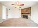 Carpeted living room with a stone fireplace and fan at 5175 Walker Rd, Stone Mountain, GA 30088
