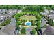A beautiful aerial view of community green space featuring mature trees, gazebo, and blue splash pad at 6585 Creekview Cir, Duluth, GA 30097