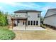 Stunning backyard featuring a covered patio and landscaped yard; perfect for outdoor living at 6585 Creekview Cir, Duluth, GA 30097