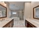 Large primary bathroom featuring double vanities, soaking tub, and tiled walk-in shower at 6585 Creekview Cir, Duluth, GA 30097