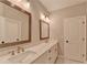 Bright bathroom featuring double vanity, quartz countertop, and modern fixtures at 6585 Creekview Cir, Duluth, GA 30097