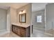 Bathroom with vanity, quartz countertop, wood frame mirror, and tile flooring at 6585 Creekview Cir, Duluth, GA 30097