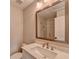 Bathroom featuring tiled shower, marble vanity with chrome hardware, and modern mirror at 6585 Creekview Cir, Duluth, GA 30097