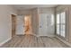 This bedroom features a bathroom and a window with shutters at 6585 Creekview Cir, Duluth, GA 30097