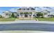 Community clubhouse featuring grand entrance, stone facade, and manicured landscaping at 6585 Creekview Cir, Duluth, GA 30097