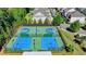 Overhead shot of basketball and tennis courts with green surroundings, creating a recreational haven at 6585 Creekview Cir, Duluth, GA 30097