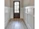 Elegant foyer with paneled walls and hardwood floors, leading into the home at 6585 Creekview Cir, Duluth, GA 30097