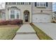 Beautiful home with a brick facade, arched entryway, and manicured landscaping for a welcoming curb appeal at 6585 Creekview Cir, Duluth, GA 30097