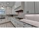 Well-appointed kitchen with white cabinets, a gas cooktop, and ample countertop space at 6585 Creekview Cir, Duluth, GA 30097