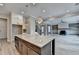 Spacious kitchen featuring a large island with a granite countertop and stainless steel appliances at 6585 Creekview Cir, Duluth, GA 30097