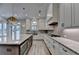 Bright kitchen with a center island, gas cooktop, stainless sink and plenty of storage space at 6585 Creekview Cir, Duluth, GA 30097