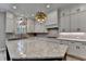 Well-designed kitchen featuring ample white cabinets and a large island for food preparation at 6585 Creekview Cir, Duluth, GA 30097