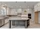 Elegant kitchen features granite countertops, white cabinets, stainless steel appliances, and a center island at 6585 Creekview Cir, Duluth, GA 30097