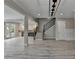Spacious living room with an open concept to the kitchen and a staircase leading to the upper level at 6585 Creekview Cir, Duluth, GA 30097