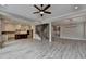 Expansive living room seamlessly connects to the kitchen and staircase, creating an inviting and functional space at 6585 Creekview Cir, Duluth, GA 30097