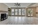 Cozy living room featuring a fireplace, large windows, and access to an outdoor patio area at 6585 Creekview Cir, Duluth, GA 30097