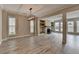 Open-concept living and dining area with ample natural light, hardwood floors, and a modern light fixture at 6585 Creekview Cir, Duluth, GA 30097