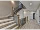 Open-concept staircase features a mix of wood and metal finishes at 6585 Creekview Cir, Duluth, GA 30097