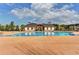 Community swimming pool area with clear blue water, sun loungers, and a decorative pool house at 6585 Creekview Cir, Duluth, GA 30097