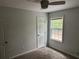 A bright bedroom featuring a window, carpet floors, neutral decor, and a ceiling fan at 6921 Babbling Brook Dr, Rex, GA 30273