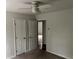 Bedroom with carpet, neutral walls, and ample closet space for comfortable living at 6921 Babbling Brook Dr, Rex, GA 30273