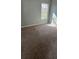Bedroom with carpeted flooring and a window providing natural light at , Covington, GA 30016