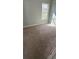 Bedroom with carpeted flooring and a window providing natural light at , Covington, GA 30016