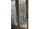 An up-close view of French Doors with a multi-pane design and exterior greenery visible at , Covington, GA 30016