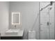 Modern bathroom with a sleek vanity, illuminated mirror, and a glass-enclosed shower at 1604 Niskey Lake Sw Rd, Atlanta, GA 30331