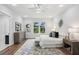 Bright bedroom with hardwood floors, white walls, chandelier, large windows and neutral-toned decor at 1604 Niskey Lake Sw Rd, Atlanta, GA 30331