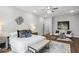 Bright bedroom with hardwood floors, white walls, chandelier, and a sitting area at 1604 Niskey Lake Sw Rd, Atlanta, GA 30331
