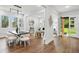 Inviting open-concept dining area with hardwood floors, modern lighting, and a view of the outdoors at 1604 Niskey Lake Sw Rd, Atlanta, GA 30331