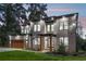Modern home with a balcony, stone accents, and well-manicured front yard, perfect for families at 1604 Niskey Lake Sw Rd, Atlanta, GA 30331