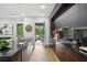 Open kitchen area featuring black countertops and views to the outdoor patio at 1604 Niskey Lake Sw Rd, Atlanta, GA 30331