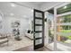Bright living room featuring modern decor, stylish furnishings, and hardwood floors at 1604 Niskey Lake Sw Rd, Atlanta, GA 30331