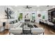 Open-concept living room boasts modern décor, fireplace, and seamless flow to the kitchen at 1604 Niskey Lake Sw Rd, Atlanta, GA 30331