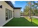 Spacious outdoor deck with artificial turf offering a view of the surrounding neighborhood at 1604 Niskey Lake Sw Rd, Atlanta, GA 30331