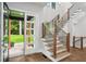 Beautiful staircase with wood treads, modern railings, and ample natural light at 1604 Niskey Lake Sw Rd, Atlanta, GA 30331