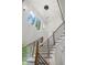 Modern staircase with wood treads, black metal railings, and an abundance of natural light at 1604 Niskey Lake Sw Rd, Atlanta, GA 30331