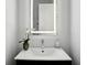 Modern bathroom features a sleek vanity, undermount sink, and a decorative orchid for an elegant touch at 1610 Niskey Lake Sw Rd, Atlanta, GA 30331