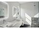 Modern bathroom featuring double sinks, sleek fixtures, and a stylish glass shower at 1610 Niskey Lake Sw Rd, Atlanta, GA 30331