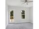 A bright and airy bedroom boasts neutral carpet and ceiling fan at 1610 Niskey Lake Sw Rd, Atlanta, GA 30331