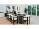 Modern dining room features stylish furniture and decor, with natural light from the sliding glass door at 1610 Niskey Lake Sw Rd, Atlanta, GA 30331