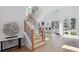 Inviting entryway featuring a wood staircase, designer decor, and seamless transition to the bright living space at 1610 Niskey Lake Sw Rd, Atlanta, GA 30331