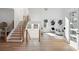 Inviting entryway featuring a staircase, designer decor, and seamless transition to the bright living space at 1610 Niskey Lake Sw Rd, Atlanta, GA 30331