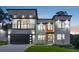 Modern two-story home with a two-car garage, balcony, and manicured lawn at 1610 Niskey Lake Sw Rd, Atlanta, GA 30331