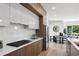 Modern kitchen with quartz counters, stainless appliances, and hardwood flooring at 1610 Niskey Lake Sw Rd, Atlanta, GA 30331